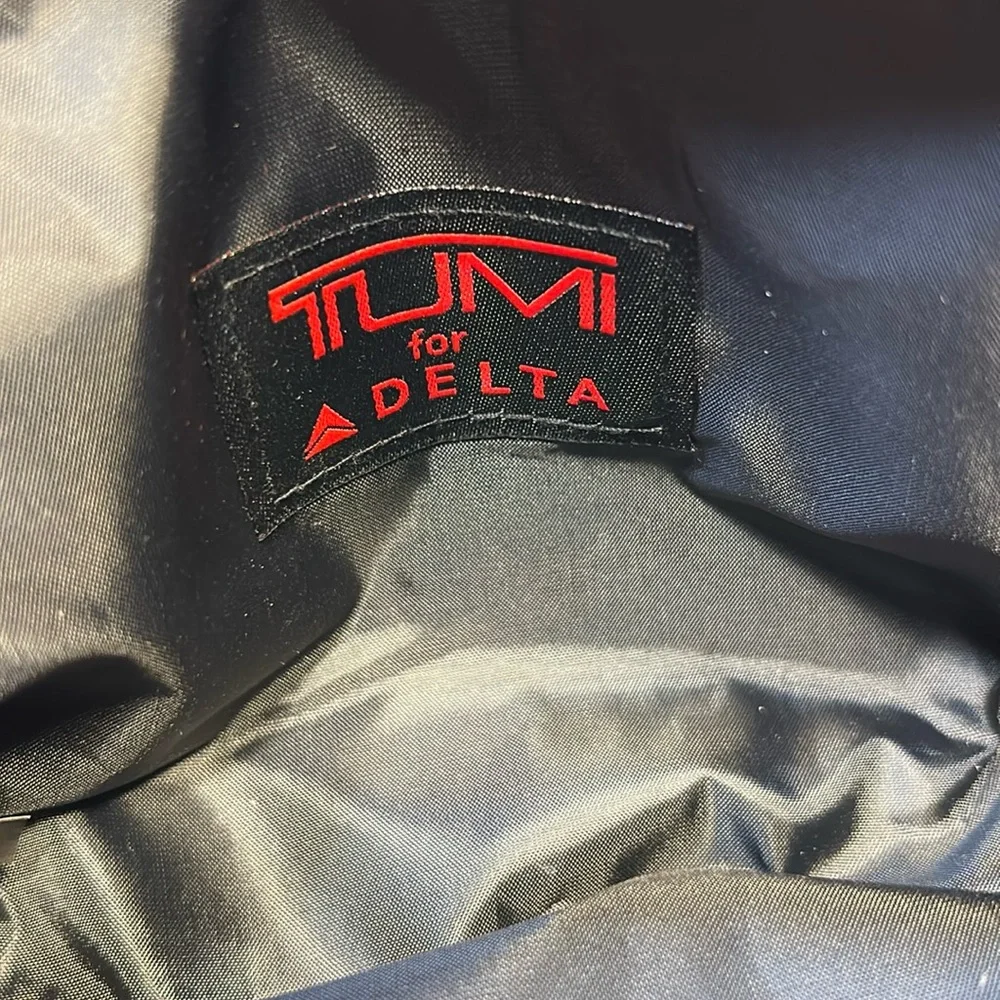 TUMI new never used cosmetic bag with some goodies